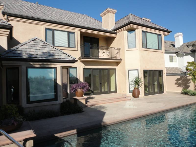 Modern house with a balcony and large glass doors