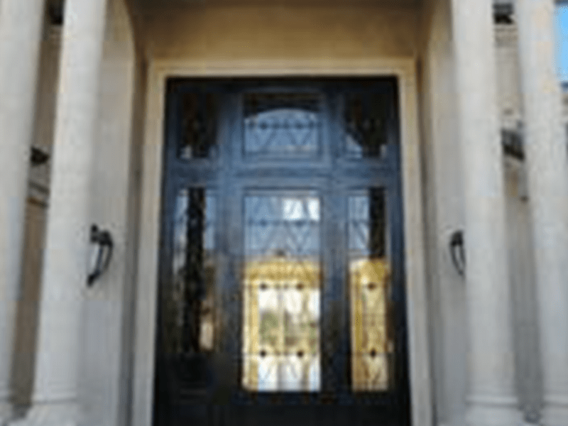 Elegant black double doors with decorative glass panels
