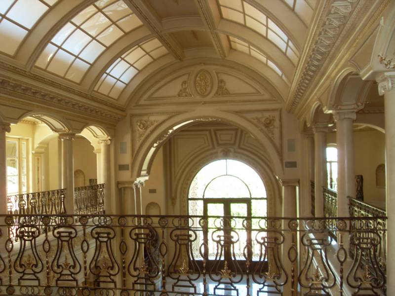 Elegant interior of a grand hall features ornate arches